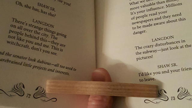  and even. Cut the the piece into a triangle. Drilled the hole with drill press. Then carved the desired shape with a combo of a chisel and sander. Sanded it smooth, and applied some finish, sand again and done. (In hindsight, I would make the wing angle a little lower, to be more diamond shaped. The higher angle let's the pages open more than might be desired.)